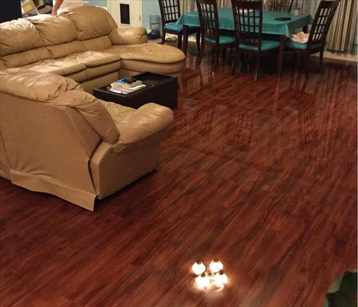 Living room floor destroyed by water damage