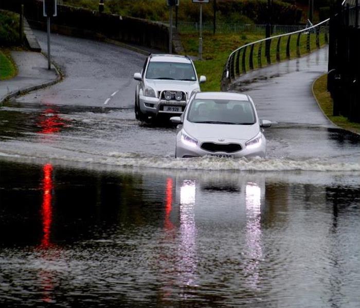 Car driving on flooded road